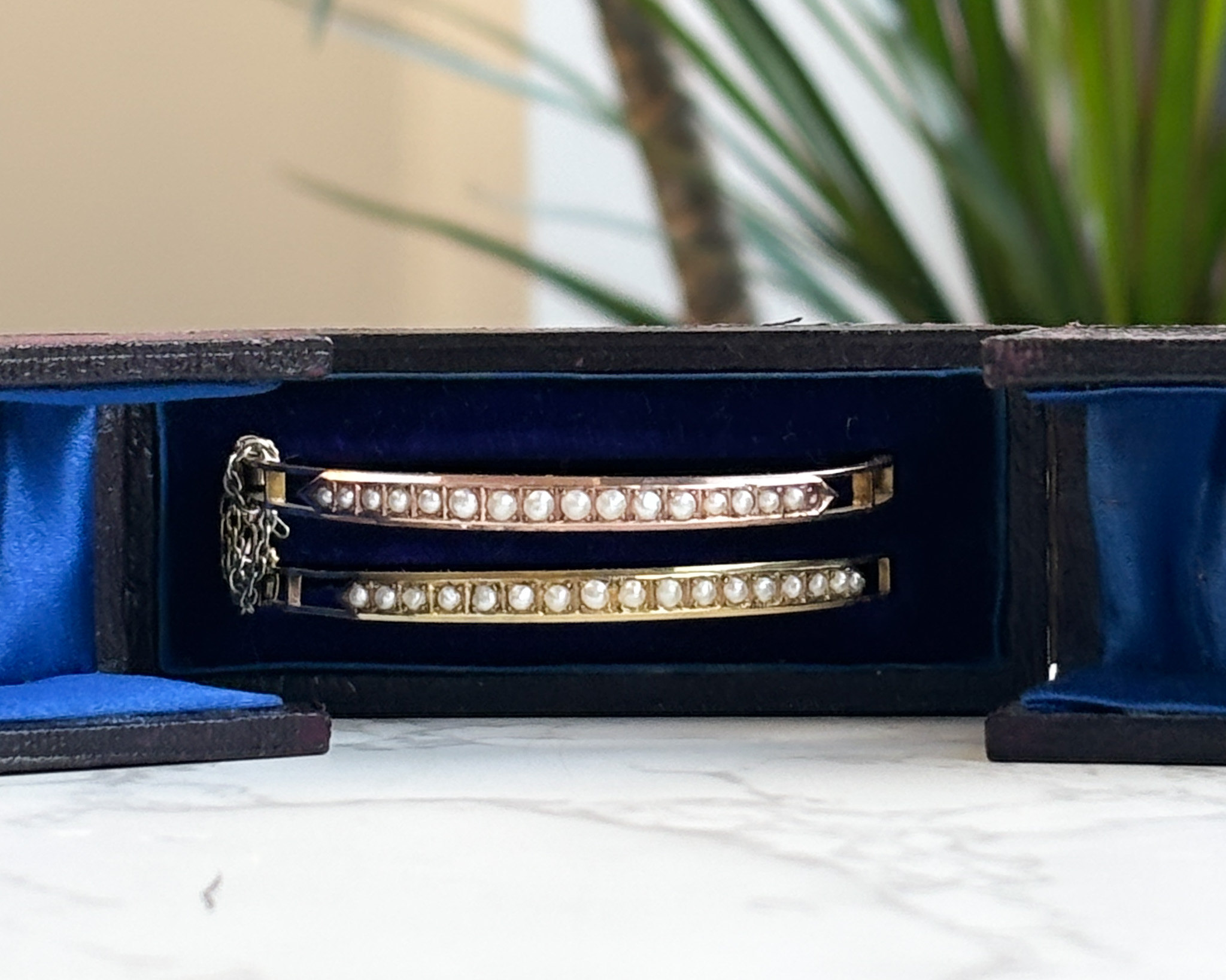 rare pair of antique Victorian rose gold and yellow gold seed pearl bangles in original box for sale in Leeds, UK