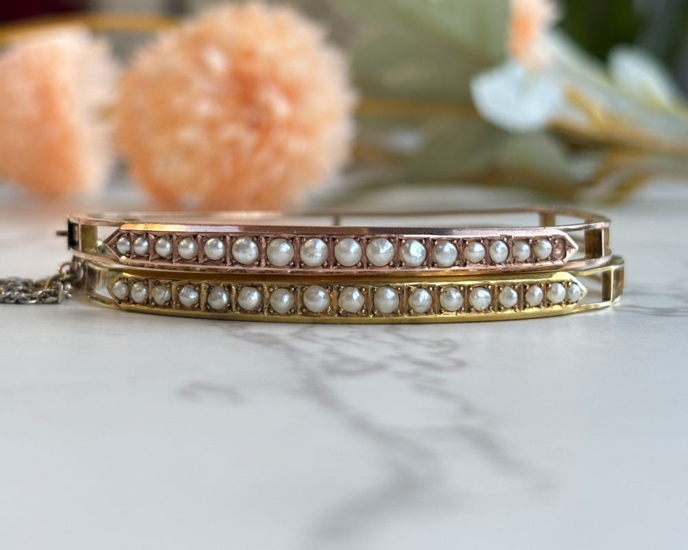 rare pair of antique Victorian rose gold and yellow gold seed pearl bangles in original box for sale in Leeds, UK