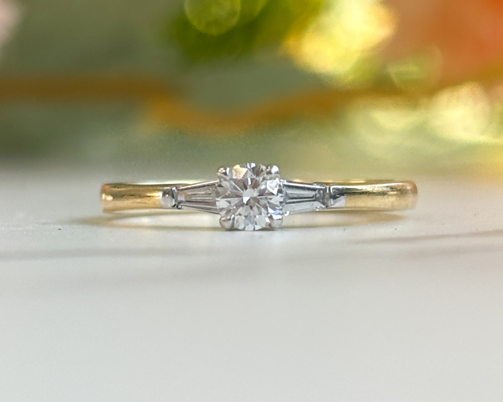 18ct gold diamond solitaire ring with baguette diamond shoulders for sale in Leeds UK