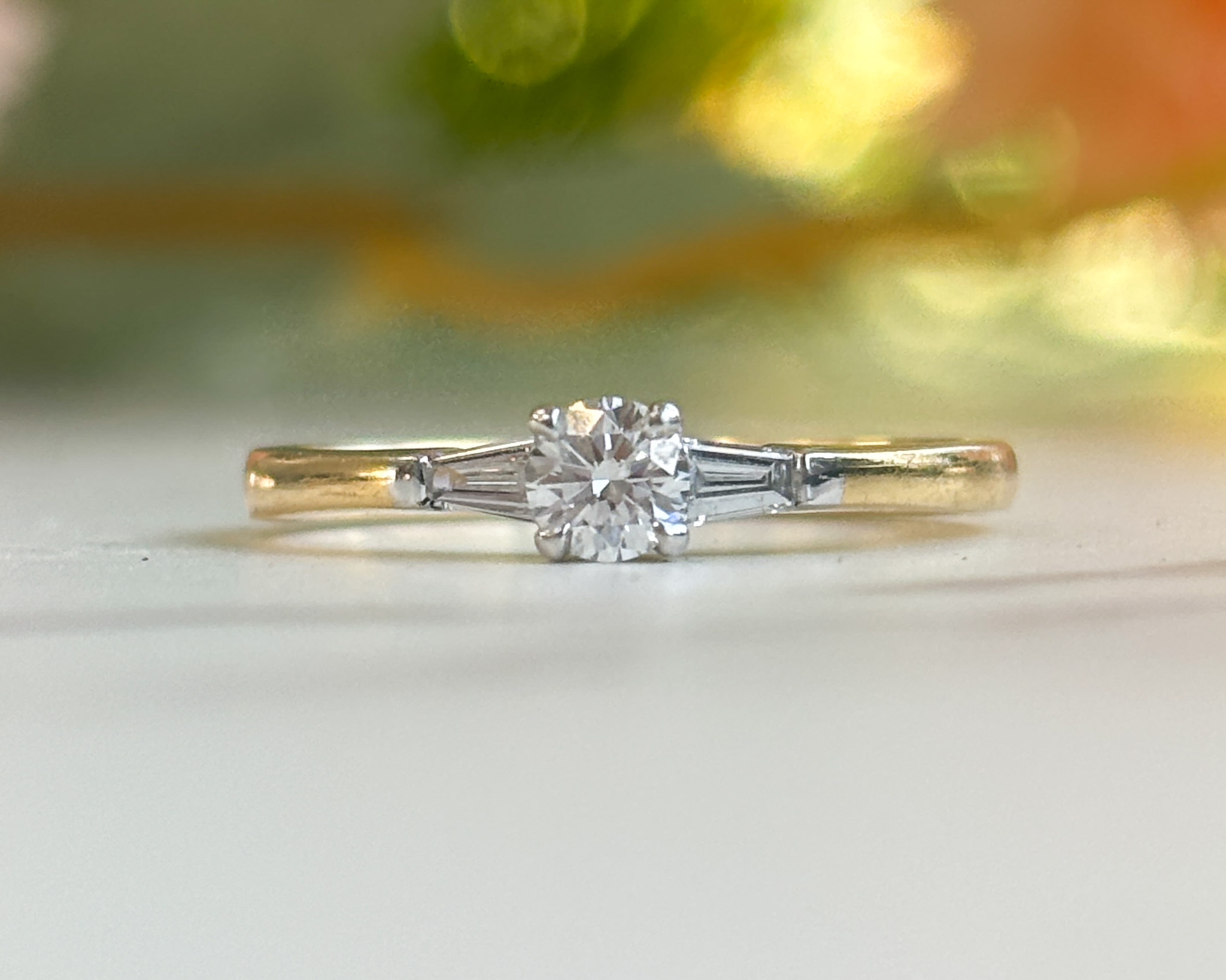 18ct gold diamond solitaire ring with baguette diamond shoulders for sale in Leeds UK