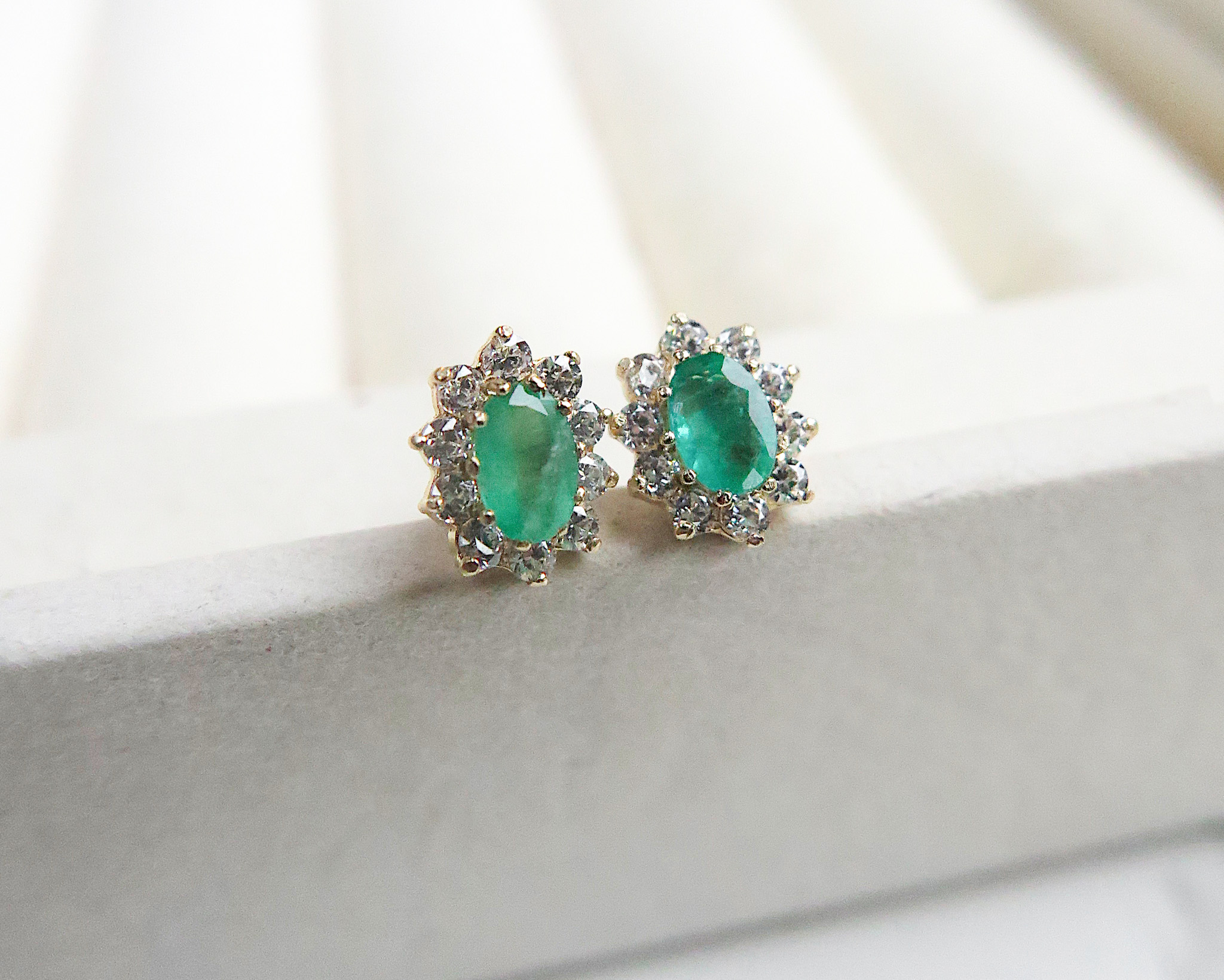 modern emerald stud earrings set in 9ct gold with a cubic zirconia halo. Cluster earrings for pierced ears