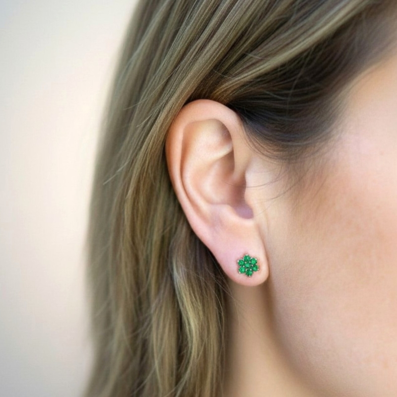 vintage style modern 9ct gold and emerald stud earrings for sale shown on model's ear