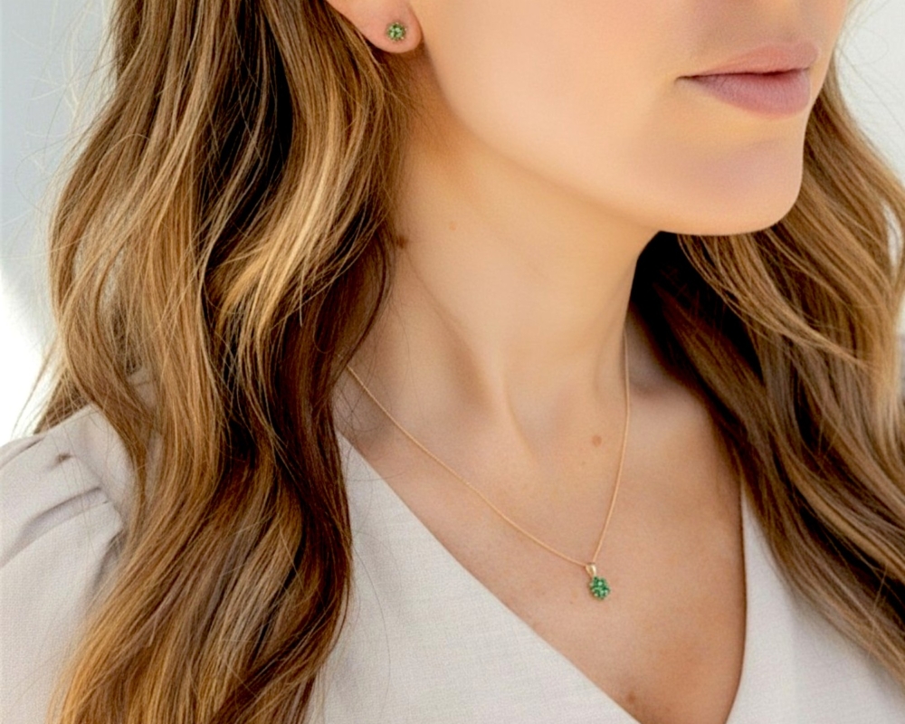 9ct gold and emerald studs and necklace on model