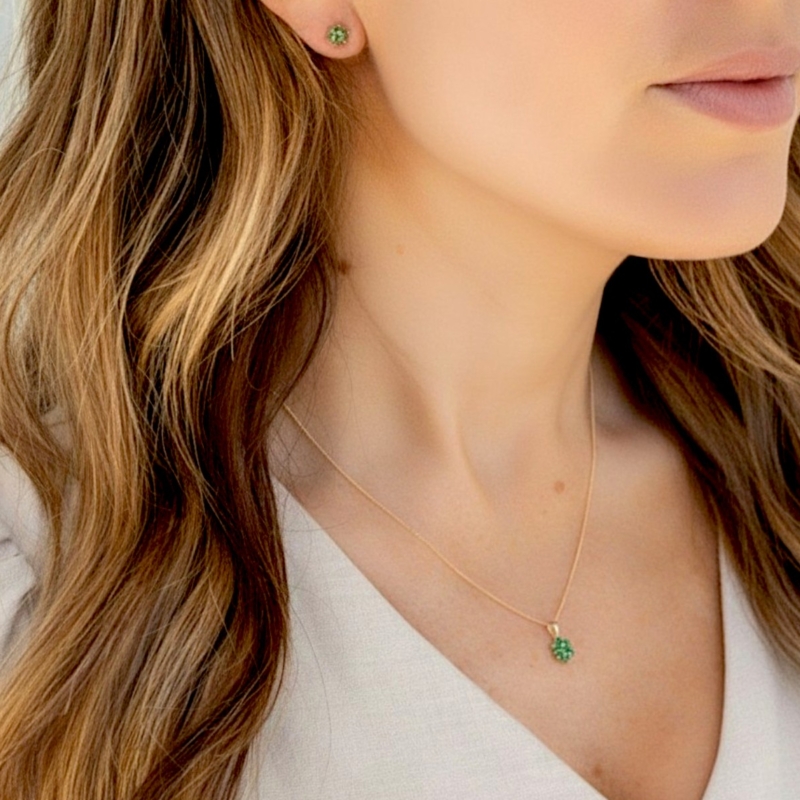 9ct gold and emerald studs and necklace on model