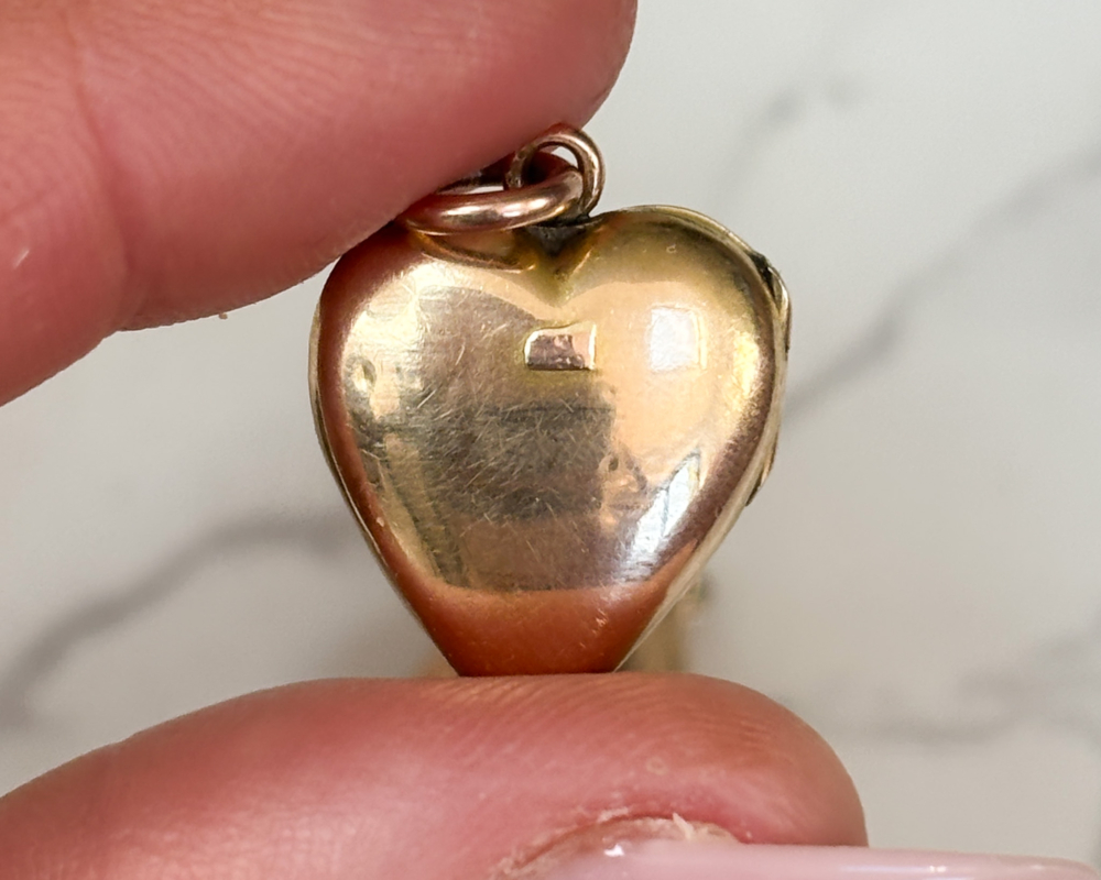antique Victorian 9ct gold and ruby set heart locket for sale in Leeds, UK