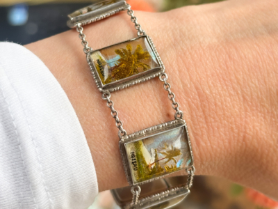 antique 1930s silver butterfly wing bracelet with scenes of Nassau, souvenir bracelet