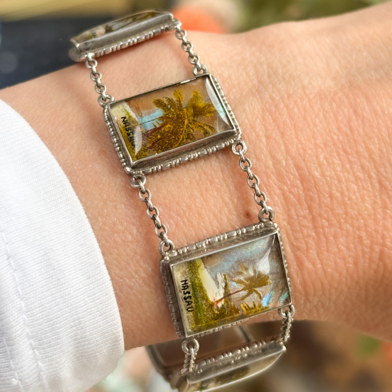 antique 1930s silver butterfly wing bracelet with scenes of Nassau, souvenir bracelet