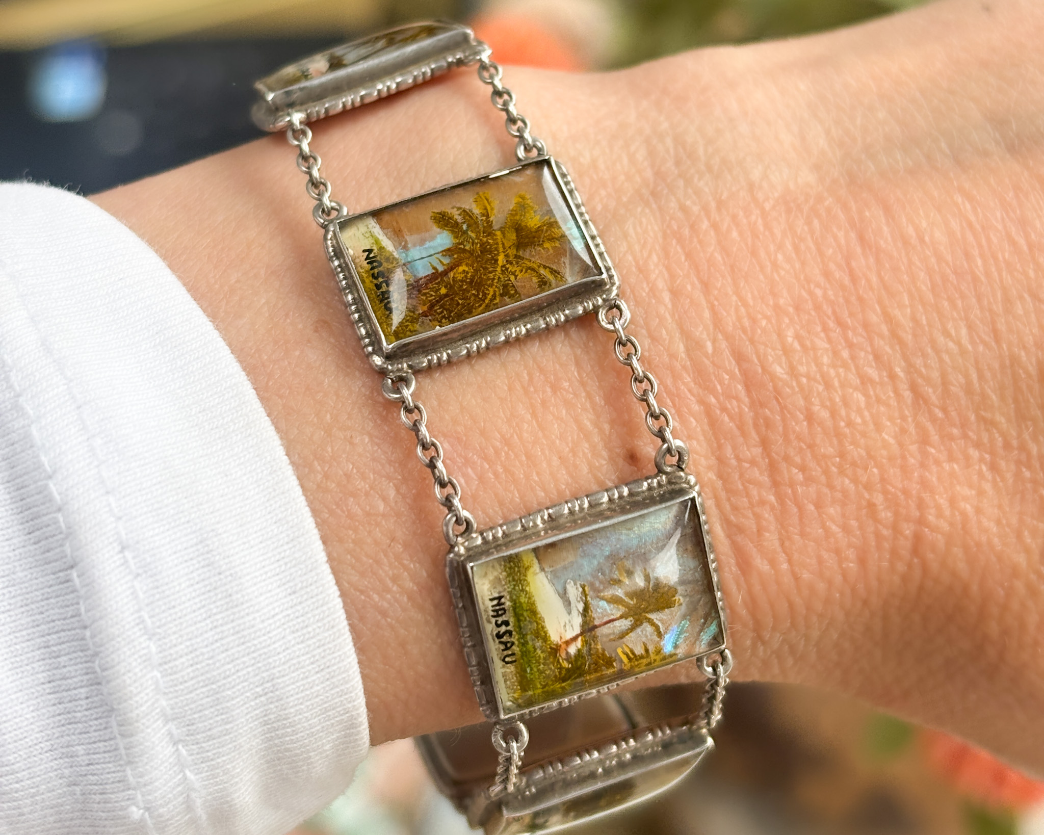 antique 1930s silver butterfly wing bracelet with scenes of Nassau, souvenir bracelet