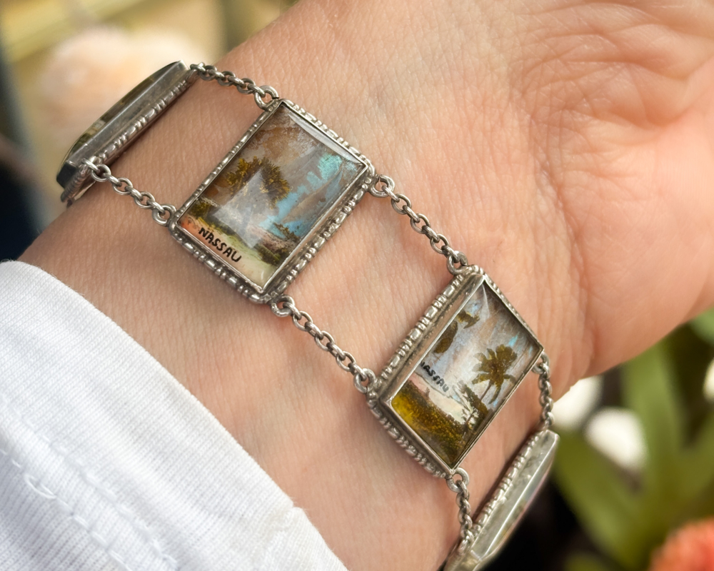 antique 1930s silver butterfly wing bracelet with scenes of Nassau, souvenir bracelet