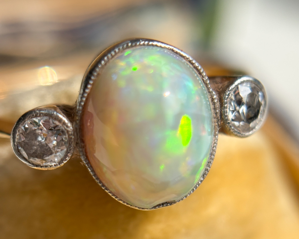 antique Victorian opal and diamond three stone ring in an antique ring box