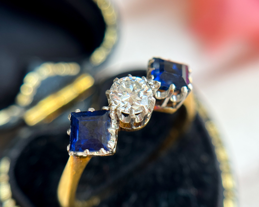 antique Art Deco sapphire and diamond three stone ring with old cut diamond and square cut sapphires for sale in Leeds, Yorkshire in a ring box