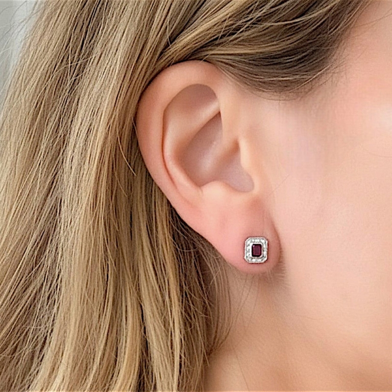 art deco ruby and diamond studs in model's ear