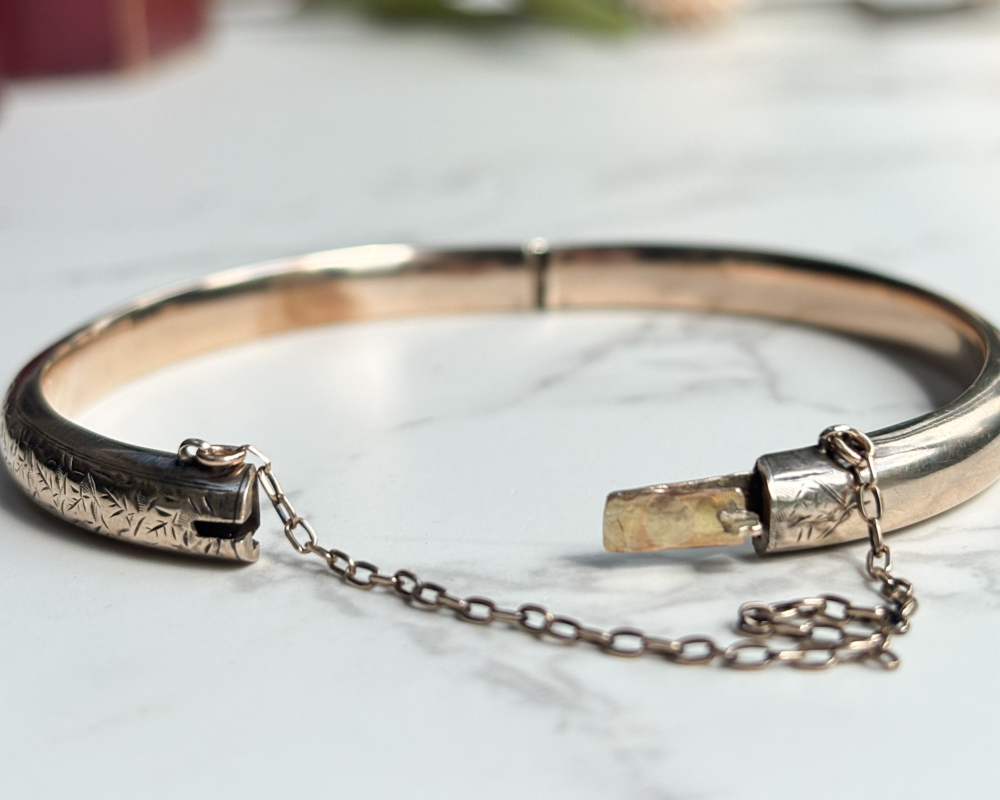 antique Edwardian 9ct gold engraved bangle for sale in Leeds, UK. Showing safety chain