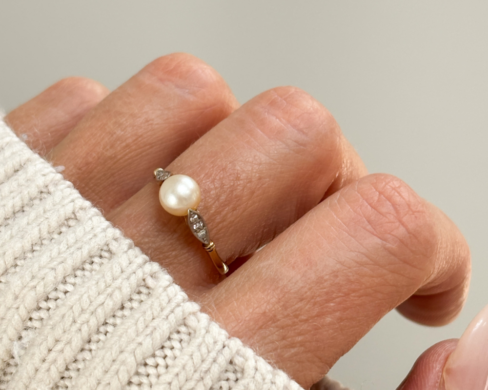 IMG_5223 (1) antique pearl and diamond ring in 9ct gold shown on a lady's finger