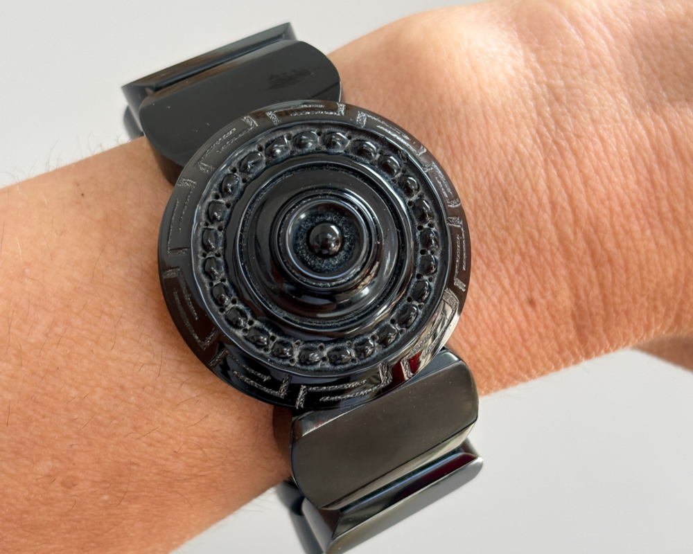 antique Victorian Whitby Jet bangle on lady's wrist