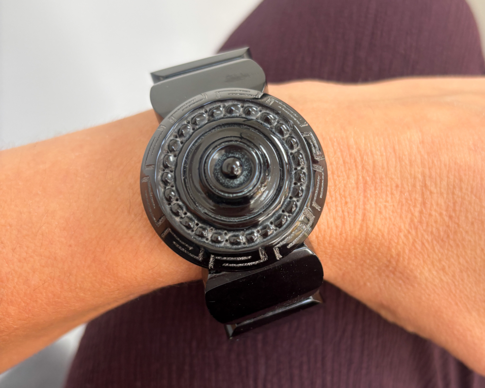 antique Victorian Whitby Jet bangle on lady's wrist