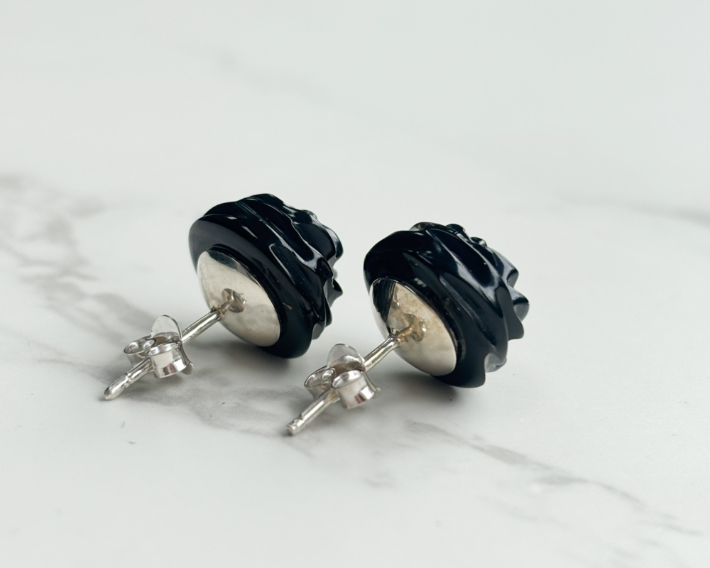 antique Whitby Jet stud earrings with silver backs, showing earrings side on