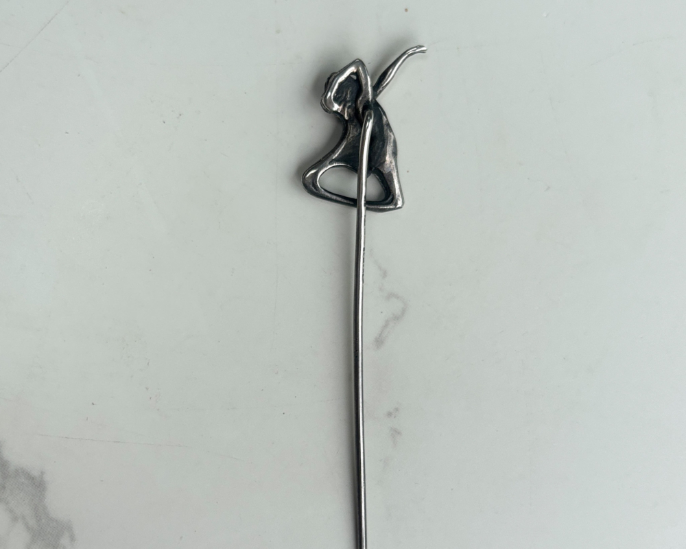 platinum art nouveau stick pin in the form of a dancer showing the reverse of the pin