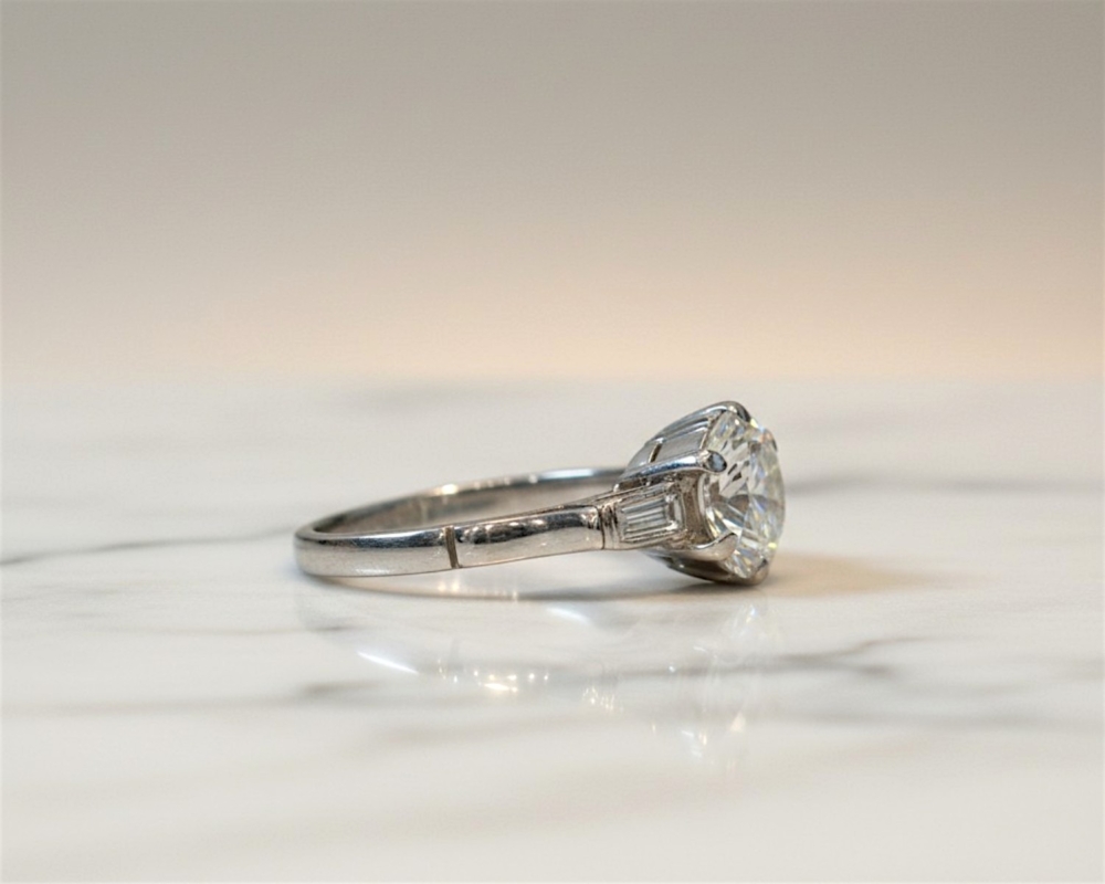 antique Art Deco 2ct diamond solitaire ring in platinum with baguette diamonds for sale in Leeds, UK side profile