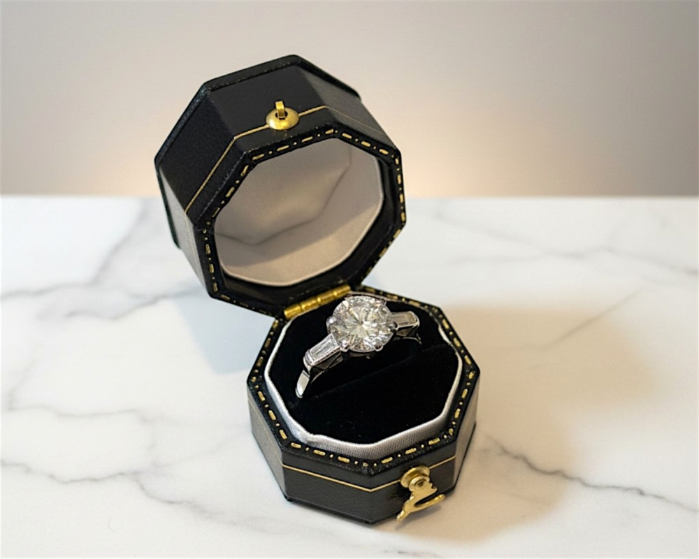 antique Art Deco 2ct diamond solitaire ring in platinum with baguette diamonds for sale in Leeds, UK in box