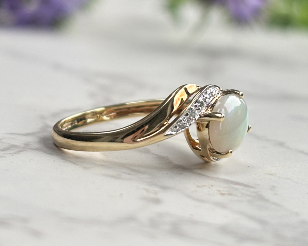 vintage 9ct gold, opal and diamond twist ring for sale in Leeds, UK, showing side view of the ring
