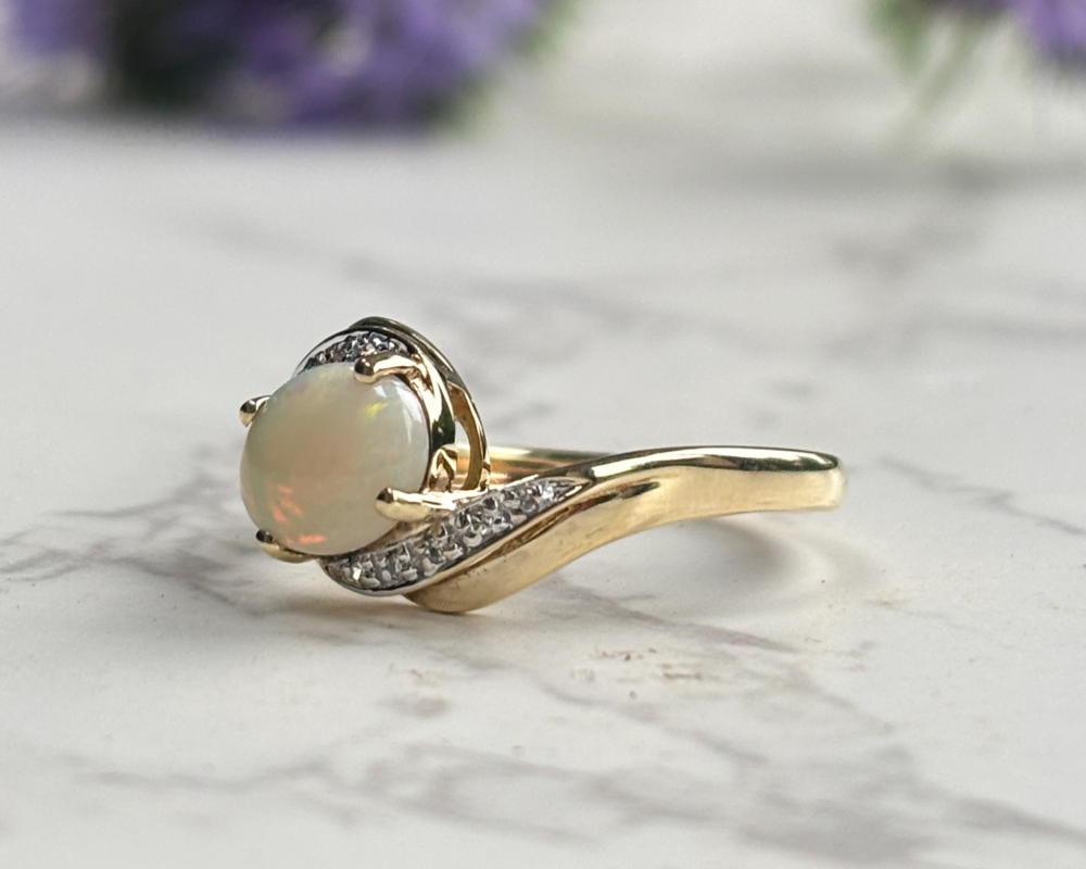 vintage 9ct gold, opal and diamond twist ring for sale in Leeds, UK showing side view of the ring