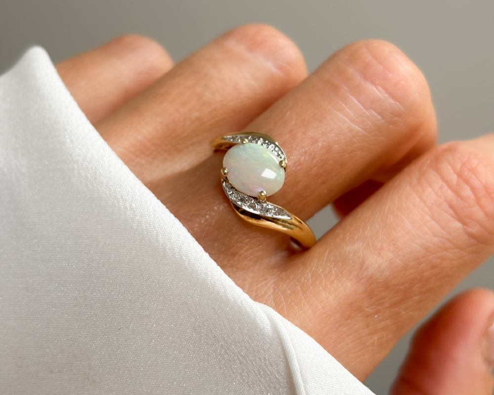 vintage 9ct gold, opal and diamond twist ring for sale in Leeds, UK, shown on lady's finger