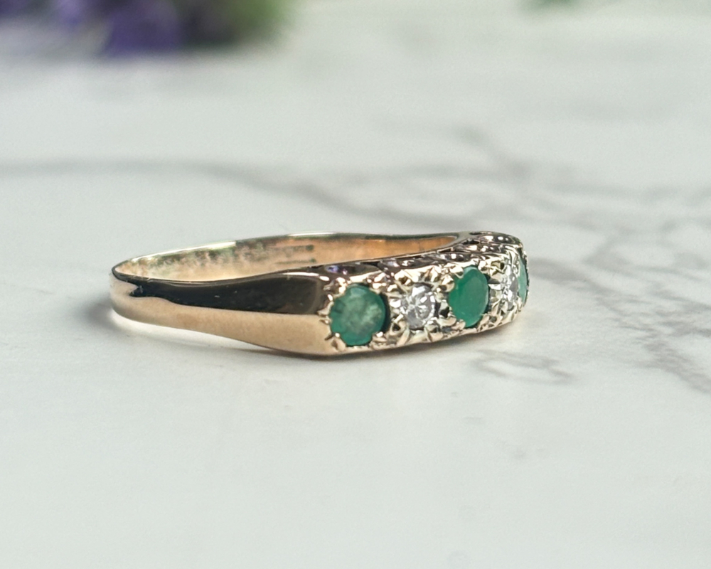 vintage mid century emerald and diamond ring in 9ct gold for sale in Leeds, UK, showing side of the ring
