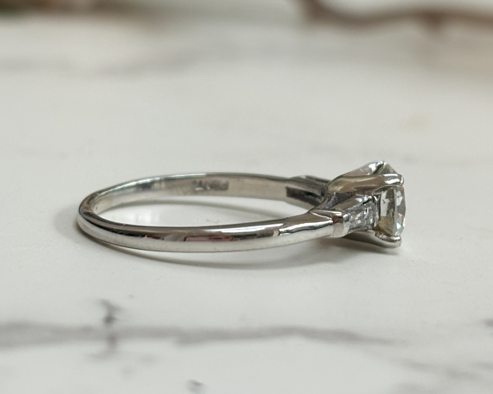art deco diamond solitaire ring with baguette diamond shoulders 1.04ct for sale in Leeds, UK, showing side view