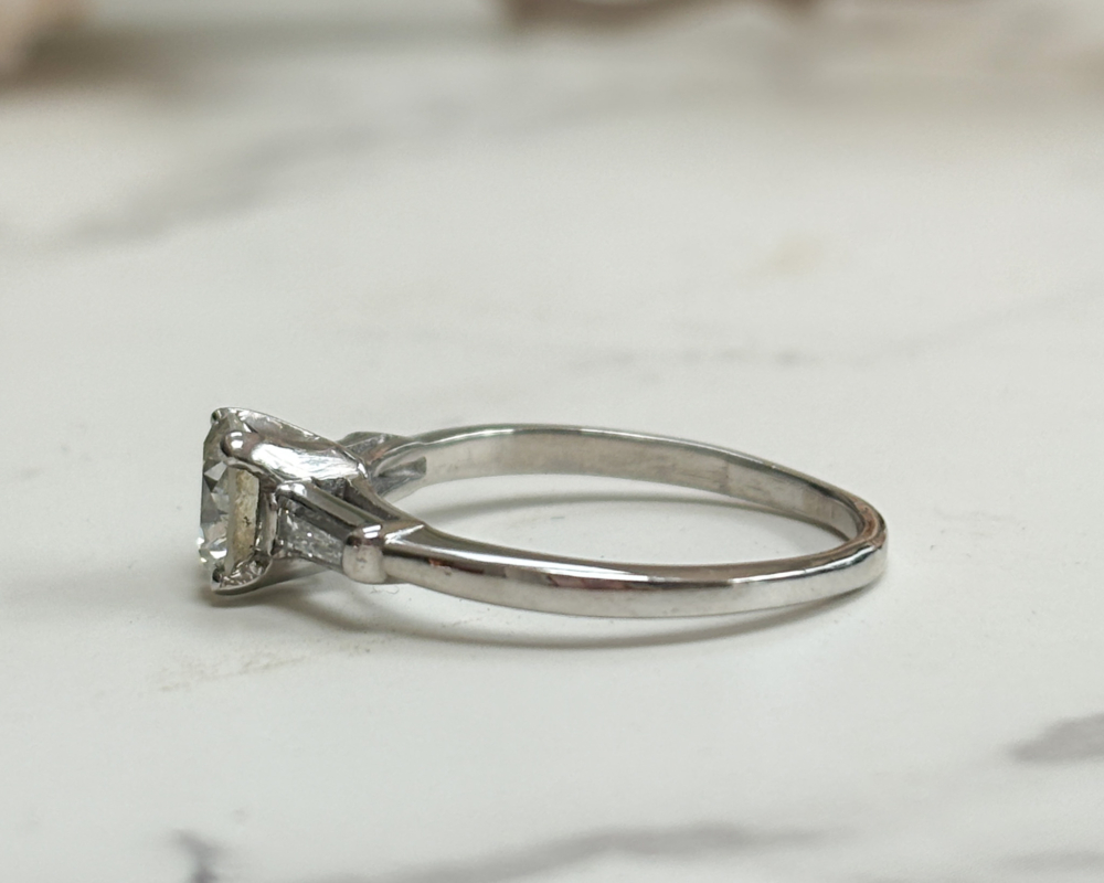art deco diamond solitaire ring with baguette diamond shoulders 1.04ct for sale in Leeds, UK, showing side view