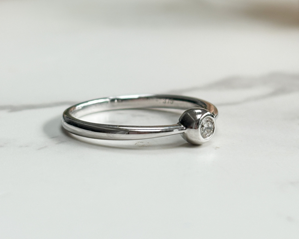 modern 9ct white gold bezel set diamond ring showing side view of the ring