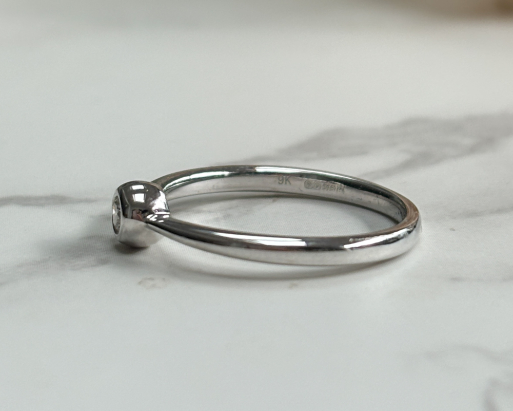 modern 9ct white gold bezel set diamond ring showing side view of the ring
