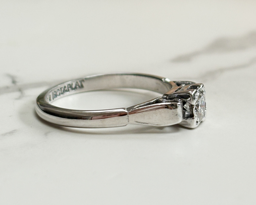 art deco diamond ring with a square setting, in 18ct white gold and platinum showing side view of the ring