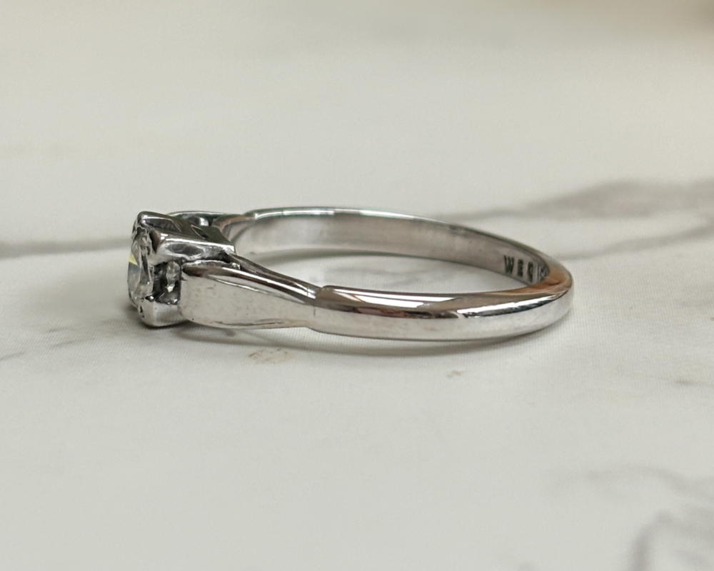 art deco diamond ring with a square setting, in 18ct white gold and platinum showing side view of the ring