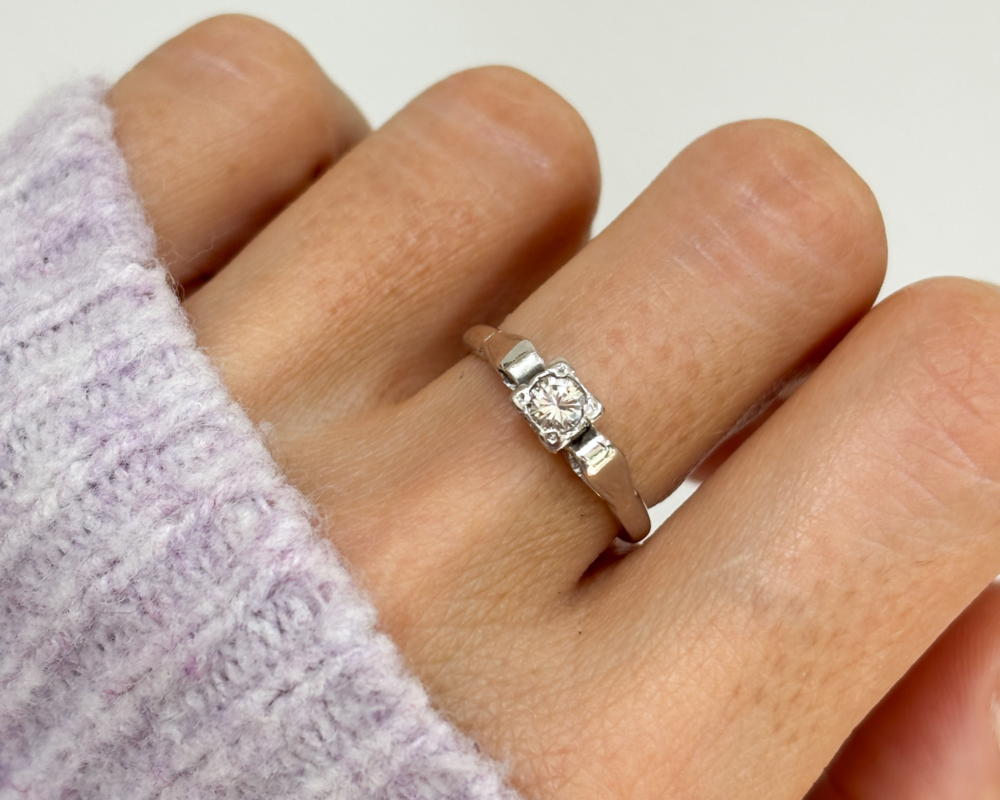 IMG_7845 art deco diamond ring with a square setting, in 18ct white gold and platinum shown on a lady's finger