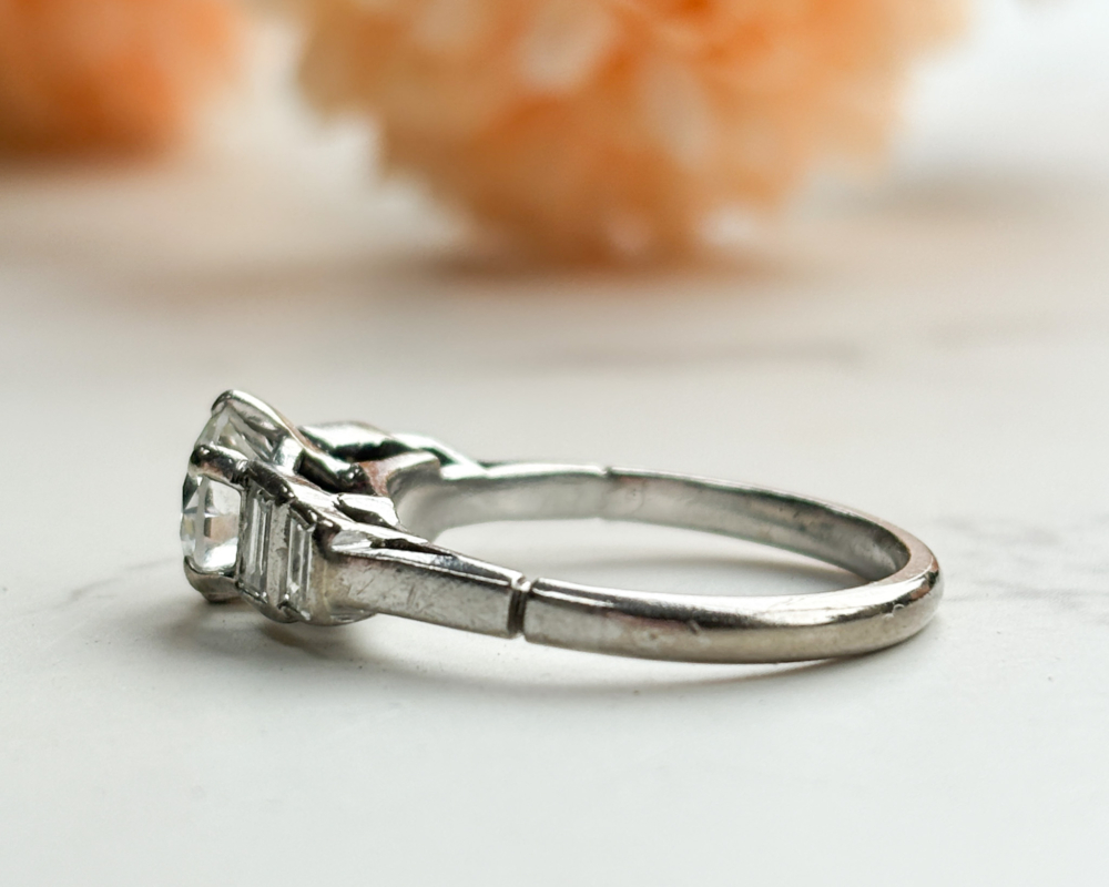 antique Art Deco diamond solitaire ring with baguette diamond shoulders 1.5ct total. For sale in Leeds, UK, showing side of the ring