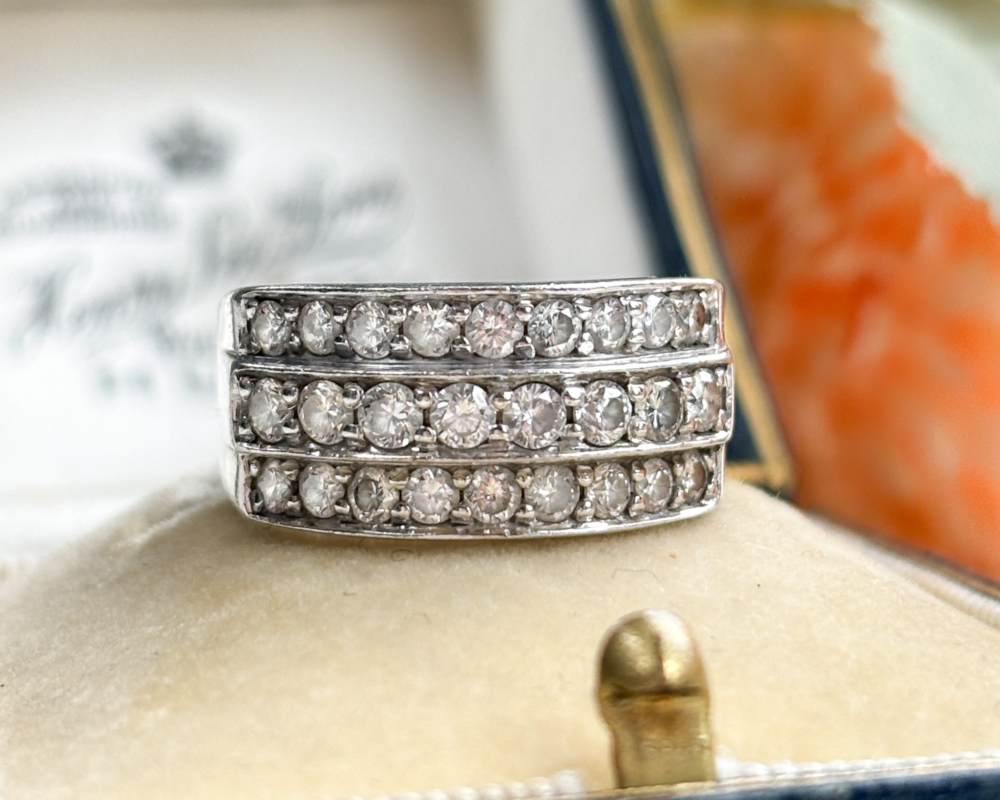 vintage triple row diamond half eternity ring in 18ct white gold, shown on a box