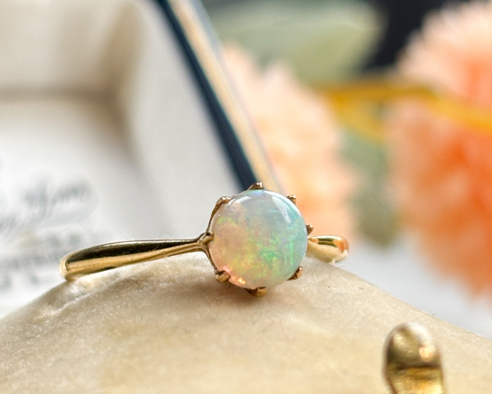 IMG_8558 antique 1920s opal ring in 18ct gold for sale in Leeds, UK. Shown on top of an old box