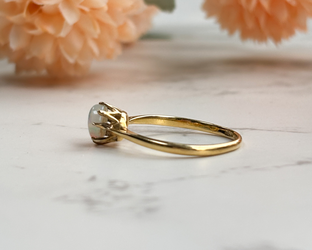 antique 1920s opal ring in 18ct gold for sale in Leeds, UK. Showing side view of the ring