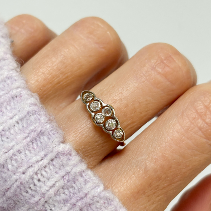 Art deco antique six stone diamond ring for sale in Leeds, UK, shown on woman's hand