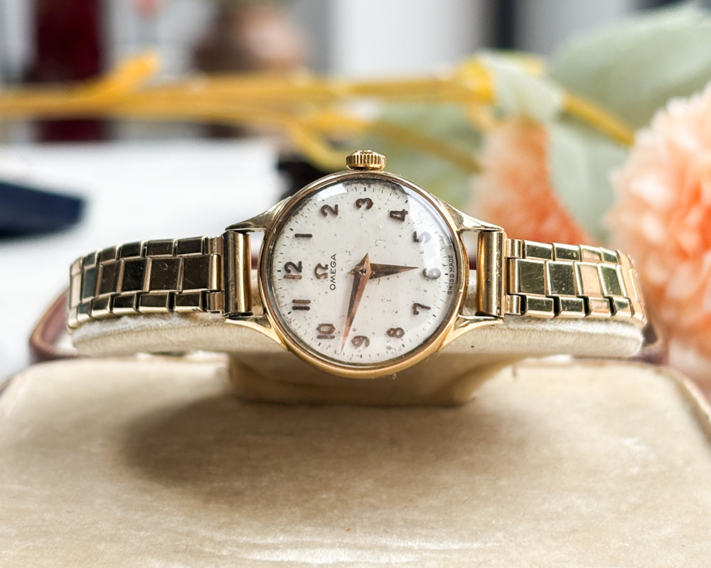 vintage omega ladies wristwatch with 9ct gold bezel and rolled gold strap. For sale in Leeds, shown in box.