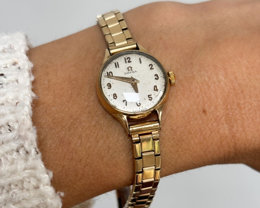 vintage omega ladies wristwatch with 9ct gold bezel and rolled gold strap. For sale in Leeds, shown on wrist