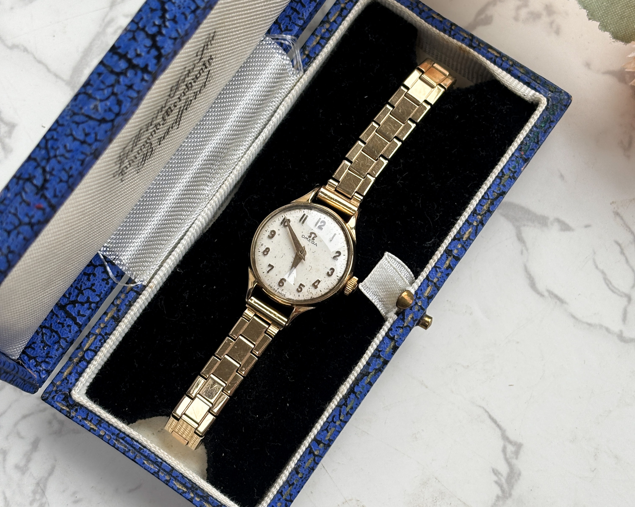 vintage omega ladies wristwatch with 9ct gold bezel and rolled gold strap. For sale in Leeds, shown in box.