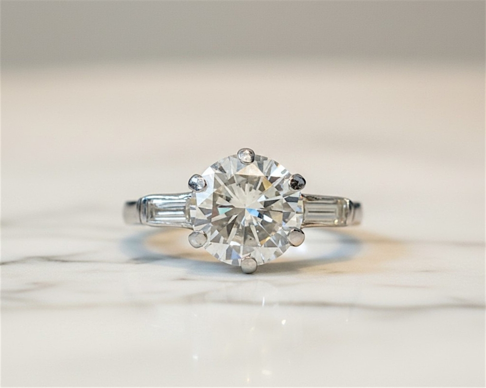 antique Art Deco 2ct diamond solitaire ring in platinum with baguette diamonds for sale in Leeds, UK