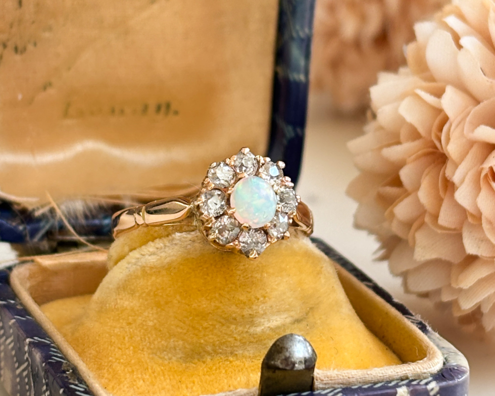 antique opal and diamond cluster ring from the Edwardian era, set in 15ct gold