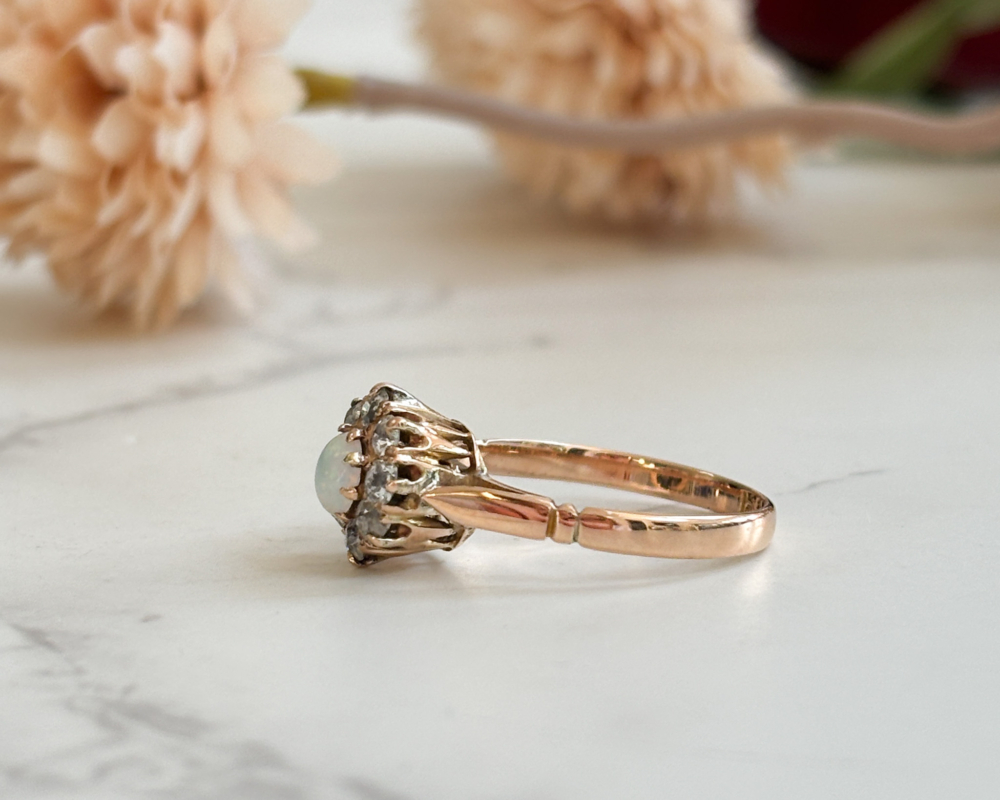 antique opal and diamond cluster ring from the Edwardian era, set in 15ct gold, showing side view of the ring