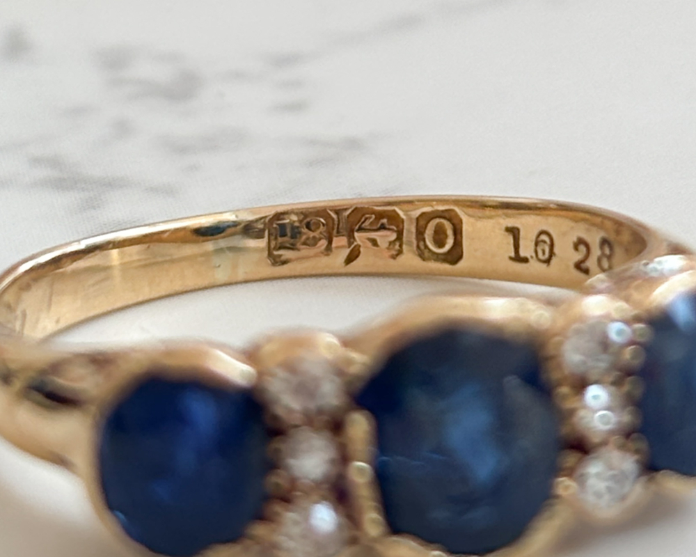 antique Edwardian sapphire and diamond three stone ring in 18ct yellow gold for sale in Leeds, UK, showing hallmark for 1913