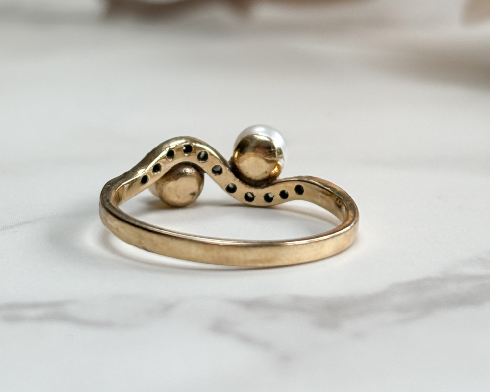 antique Edwardian pearl toi et moi ring set with diamonds, showing back view of the ring