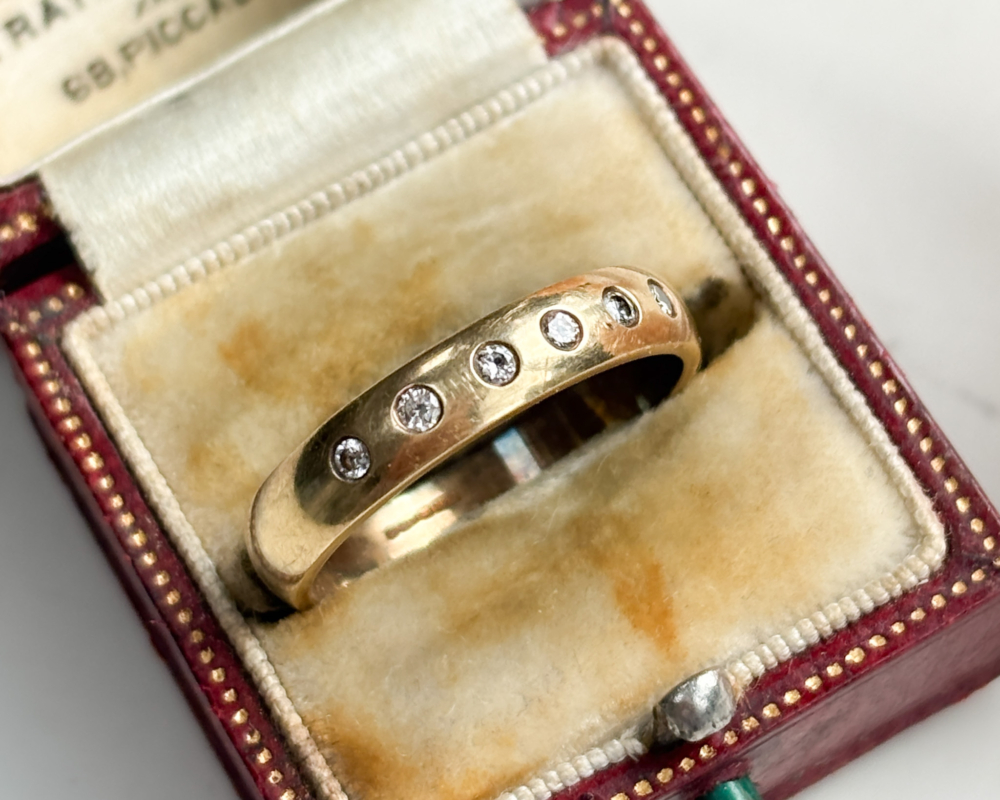 vintage 9ct gold diamond band with flush set diamonds for sale in Leeds, shown in a presentation box
