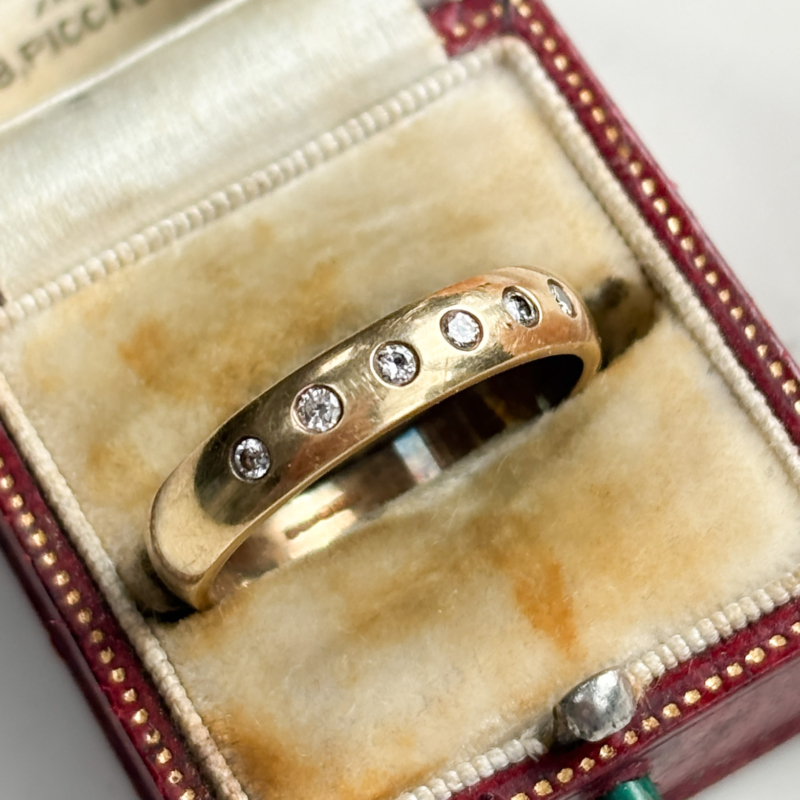vintage 9ct gold diamond band with flush set diamonds for sale in Leeds, shown in a presentation box